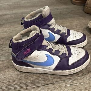 Nike girls high top sneakers. Used but still have life left to them! Size 1.5